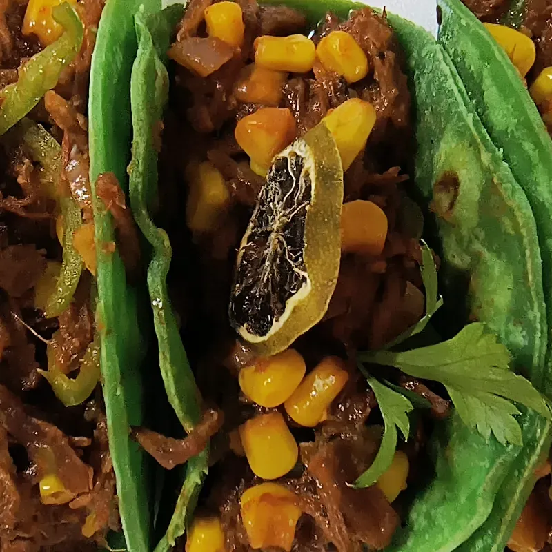 1 Taco de ropa vieja y maíz +  Jugo Natural 
